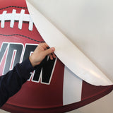 Peel and stick your custom football wall print to any smooth surface.