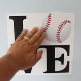 Applying your Love Baseball Wall Decal to the wall.