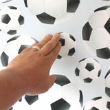 Installation of soccer ball wall prints.