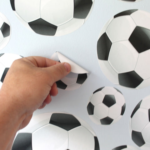 Qty 22 Soccer Ball Wall Stickers, just peel and stick to any smooth wall.