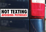Not Texting, Avoiding Potholes Bumper Sticker, 2.5"h x 8.5"w - 0671, Sticker